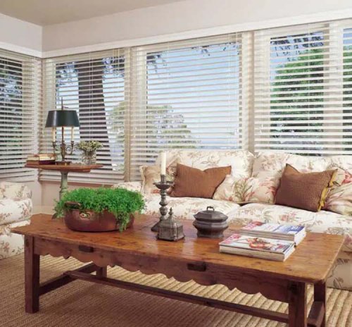 White 2-inch faux wood blinds across a living-room bay window — window treatments Big Brands Blinds supplies to Burnaby, BC
